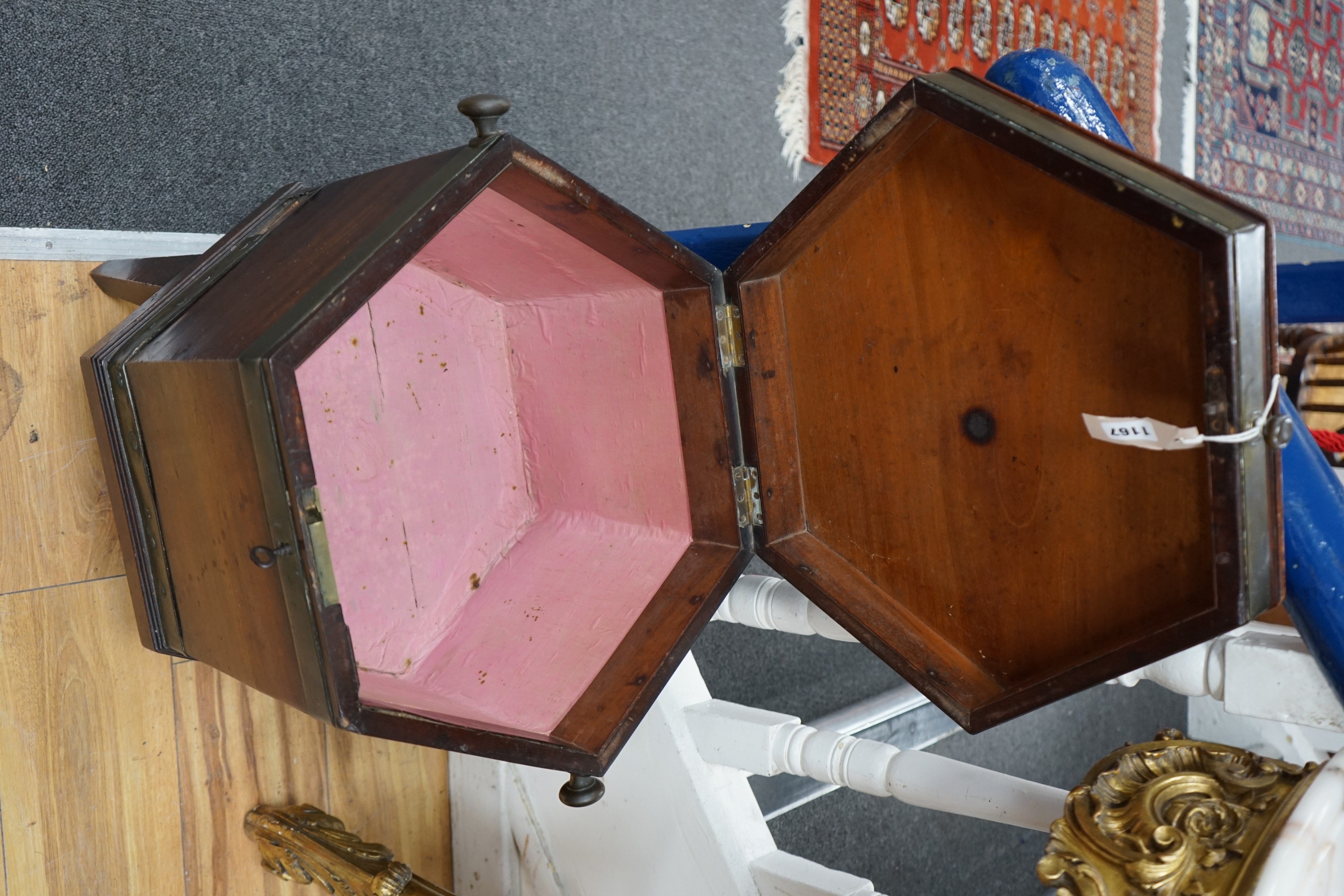 A George III mahogany and brass bound hexagonal cellaret on a reduced stand, width 43cm, height 54cm